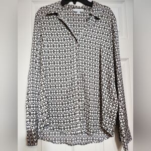 Black, Tan and White Patterned Blouse. 59% Polyester, 38% Recycled Poly, 3% Span
